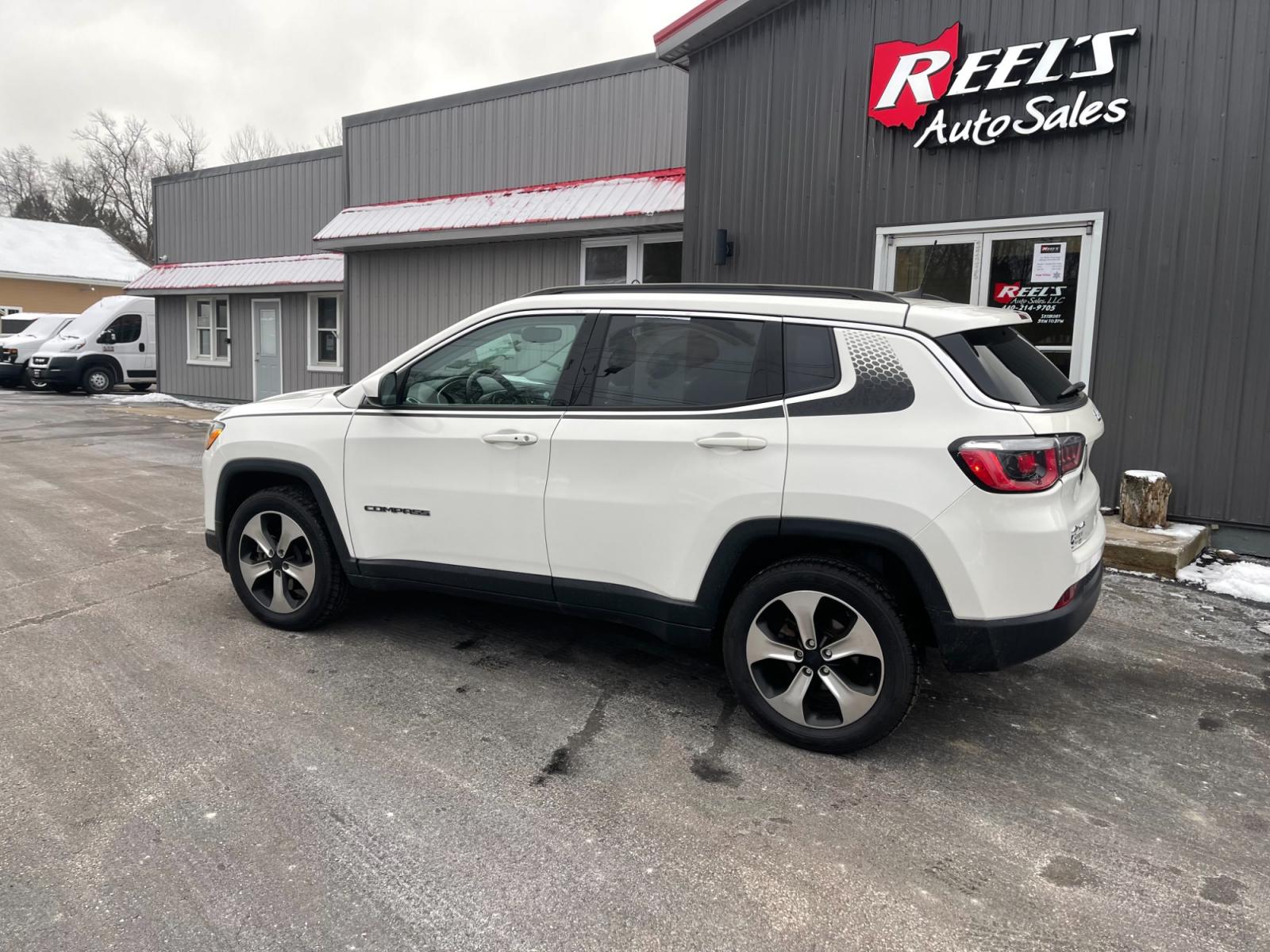 2018 White /White Jeep Compass Latitude 4WD (3C4NJDBB3JT) with an 2.4L I4 DOHC 16V engine, 9 Speed Automatic transmission, located at 11115 Chardon Rd. , Chardon, OH, 44024, (440) 214-9705, 41.580246, -81.241943 - This 2018 Jeep Compass Latitude 4WD with a 2.4-liter engine and 9-speed automatic transmission offers a blend of utility and comfort with its heated leather seats and dual-zone automatic climate control. The 8.4-inch touchscreen provides user-friendly access to navigation, Apple CarPlay, and Android - Photo #13